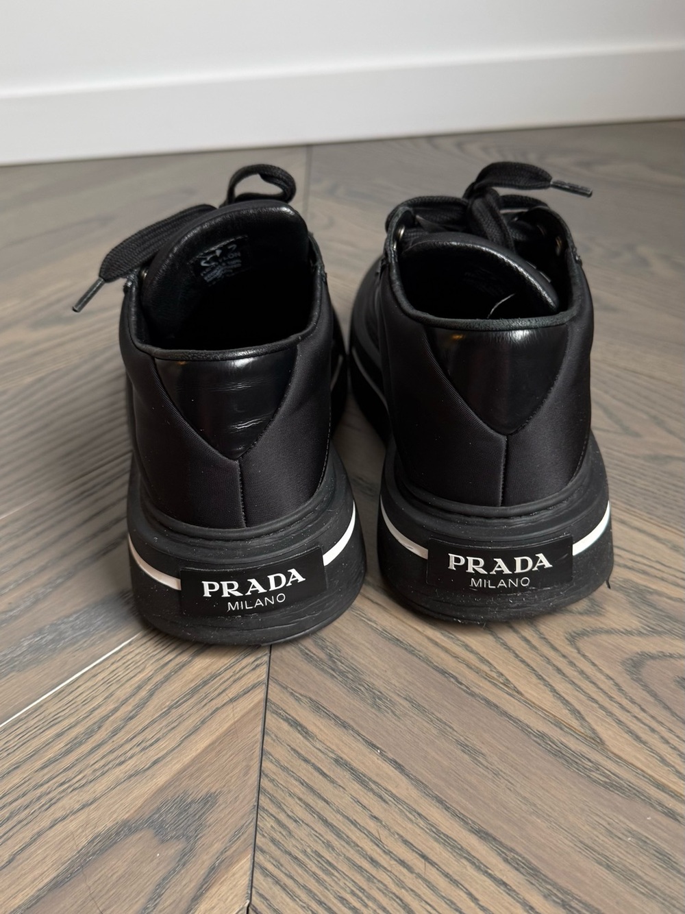 Prada Macro Re-Nylon and Brushed Leather sneakers in black, size 37.